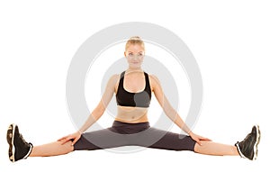 Woman in sportswear doing stretching exercise