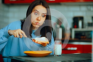 Woman Spreading Cheese Cream on Toast Bread for Breakfast