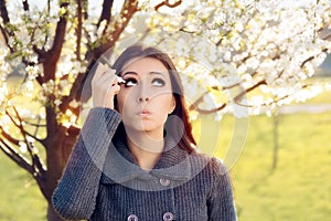 Woman with Spring Allergies Using Eye Drops