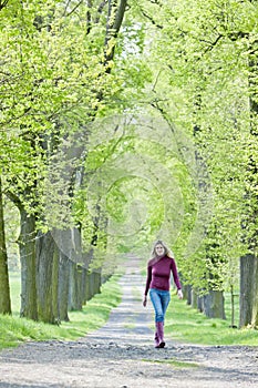 Woman in spring alley