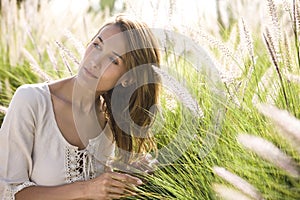 Woman in spring in the herbs