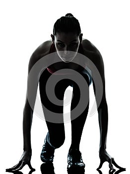 Woman sprinter on starting block