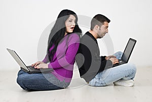 Woman spying into her husband laptop