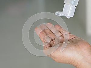 Woman squeeze gel tube using a hand wash to prevent germs protect virus covid 19