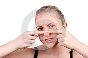 Woman squeeze pimple photo
