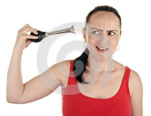 Woman squeezing horn into her own ear