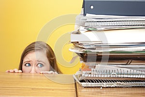 Woman stairing fearfully at files