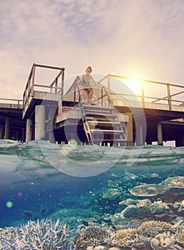 Woman on the stairs at descent to the sea and a under water view, toning