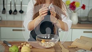 Woman Stand at Cooking Counter at Domestic Kitchen. Redhead girl.