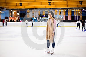 Woman stand on ice rink