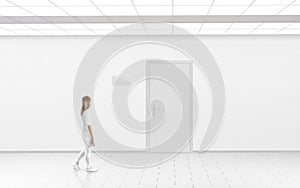Woman stand near door with blank glass name plate mockup.