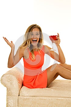 Woman stand in red sit with glass happy