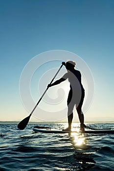 Woman on Stand Up Paddle Board photo