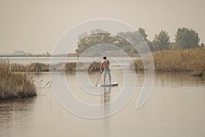 Woman stand up paddleboarding