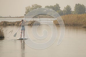 Woman stand up paddleboarding