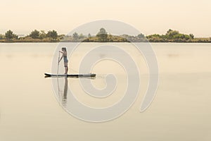 Woman stand up paddleboarding