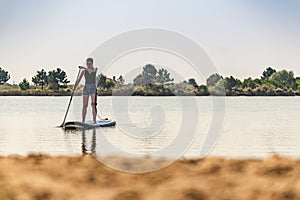 Woman stand up paddleboarding