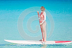 Woman stand up paddleboarding