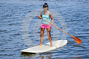 Woman stand up paddleboarding