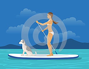 Woman Stand Up Paddling on Sap board with her Dog on a Sea