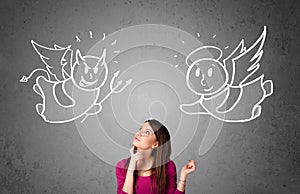 Woman standing between the angel and the devil