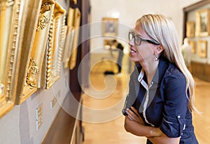 Woman standing in an art gallery