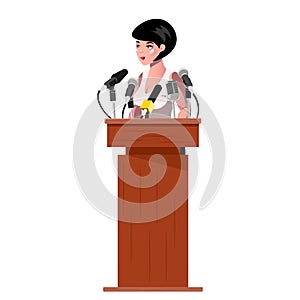 Woman standing behind rostrum and giving a speech.