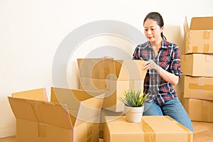 Woman standing among cardboard boxes