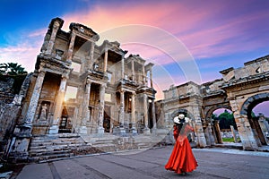 Woman standing in Celsus Library at Ephesus ancient city in Izmir, Turkey. photo