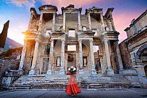 Woman standing in Celsus Library at Ephesus ancient city in Izmir, Turkey.