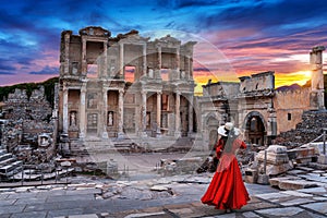 Woman standing in Celsus Library at Ephesus ancient city in Izmir, Turkey