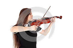 A woman standing in close up, playing the violin