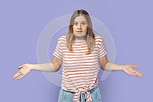 Woman standing with confused puzzled emotion, expressing embarrassment and doubts.