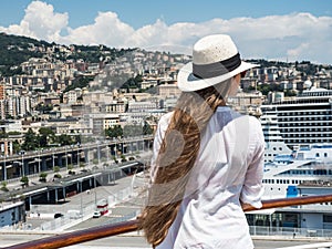 Woman standing on the deck of a cruise ship