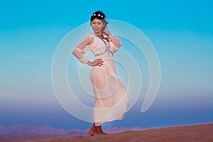 Woman standing during dusk in desert