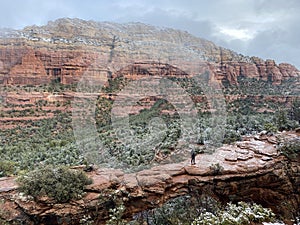 A woman standing on the famous landmark Devil\'s Bridge, outside Sedona, Arizona, USA