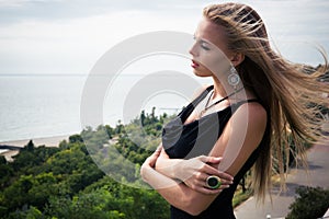 Woman standing in fashon dress outdoors