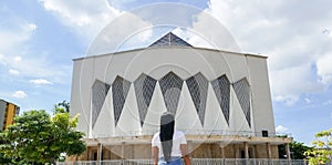 Woman standing in front of the cathedral in Barranquilla, Colombia