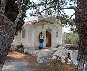 Woman standing in front of Church