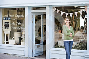 Woman standing in front of organic food store