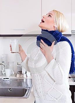 Woman standing with gargle solution