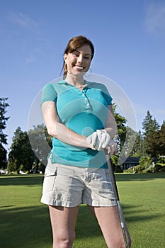 Woman Standing on Golf Course - Vertical