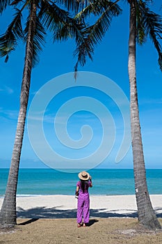 A woman standing with her back