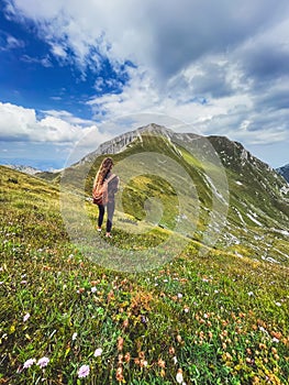 Woman Standing on Hill Overlooking Durmitor Mountains