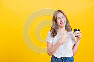 woman standing holding take away cup coffee paper and pointing with hand finger