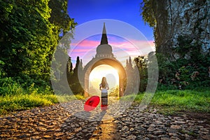 Woman standing at Khao Na Nai Luang Dharma Park in Surat Thani, Thailand.