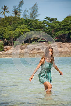 Woman standing knee-deep in water