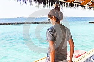 Woman standing at maldives sea