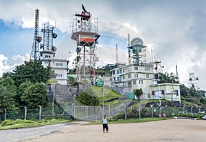 Woman standing near the strategic buildings at the military base