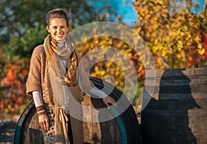 Woman standing near wooden barrel in outdoors